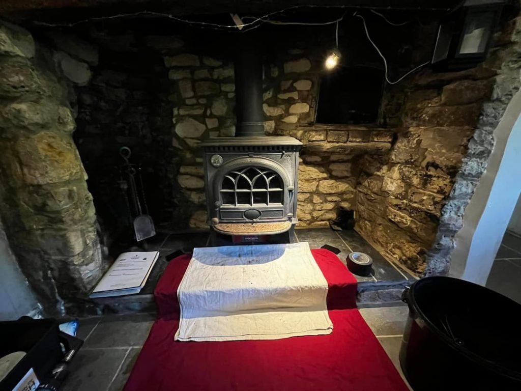 Wood Burner With Brick Backdrop